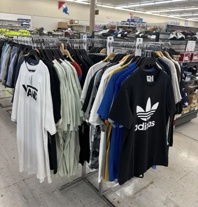 Clothing rack featuring mens tee shirts.