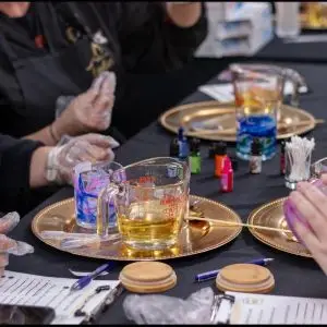 A table with candle making equipment.