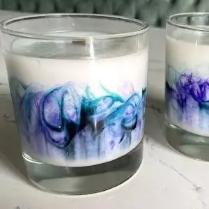 Two candles with colorful swirls.