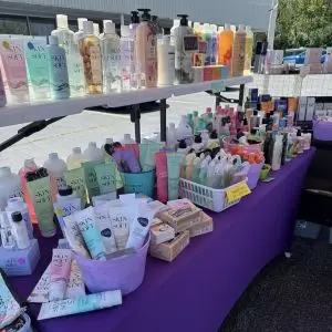 A neatly organized table of items for sale. Mostly bath gels.