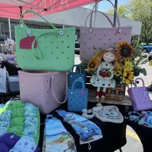 A variety of tote bags for sale.